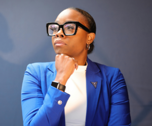 Confident woman executive in blue blazer.